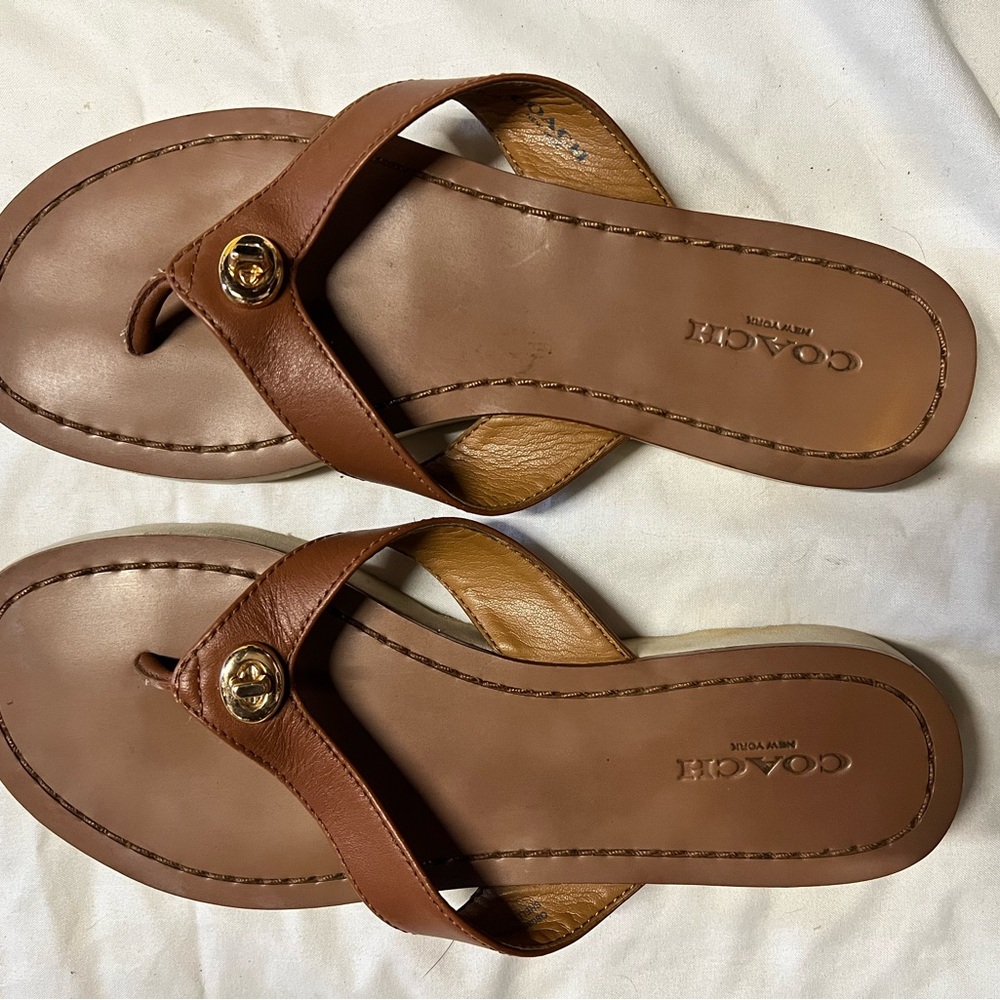 Coach brown leather flip flops, gold buckle detail, size 5